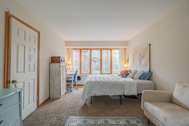 bedroom featuring light colored carpet