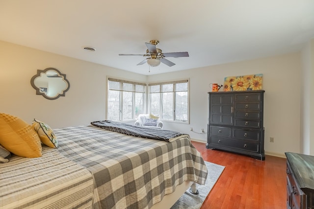 bedroom featuring ceiling fan and dark hardwood / wood-style flooring