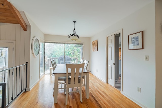 dining room featuring light hardwood / wood-style floors and an inviting chandelier