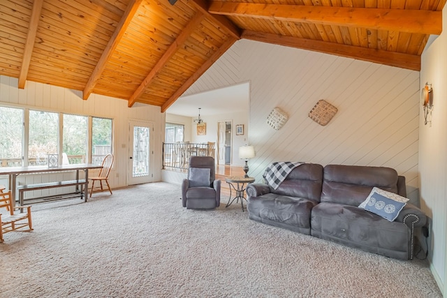 carpeted living room with vaulted ceiling with beams and wood ceiling