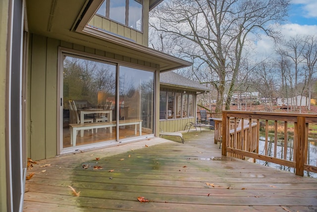 wooden terrace with a sunroom