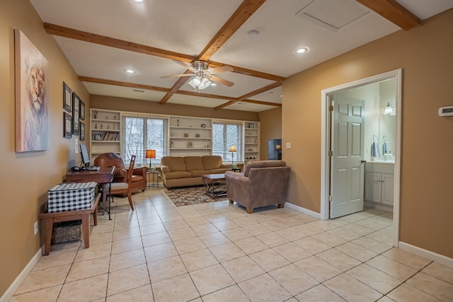 living room with ceiling fan, beam ceiling, built in features, and light tile patterned floors