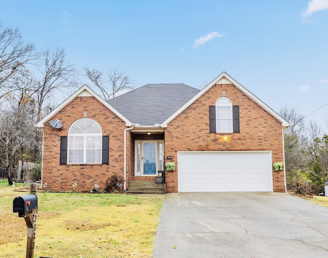 front of property with a front yard and a garage