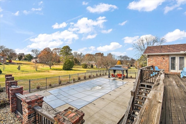 view of patio / terrace with a gazebo and a pool side deck