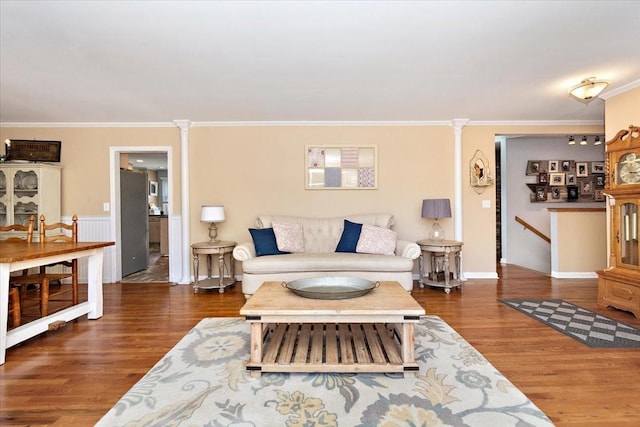 living room featuring dark hardwood / wood-style floors and ornamental molding