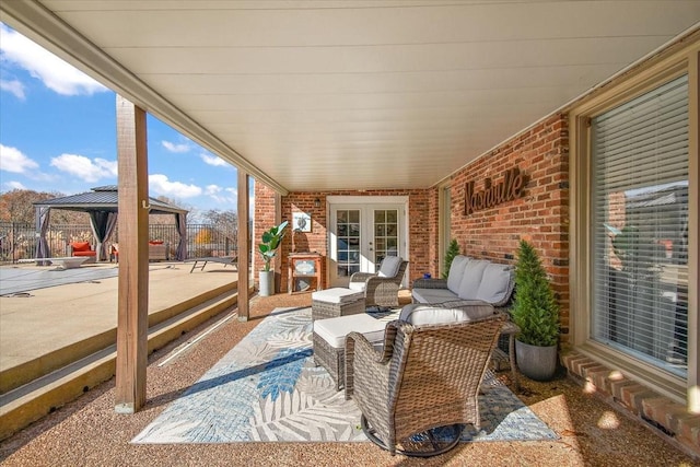 exterior space featuring outdoor lounge area, a gazebo, and french doors