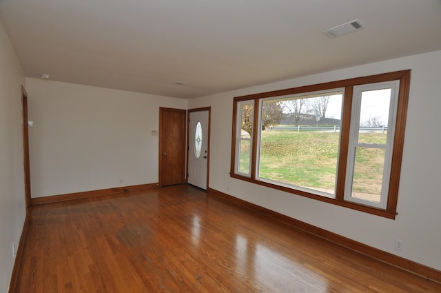 empty room featuring wood-type flooring