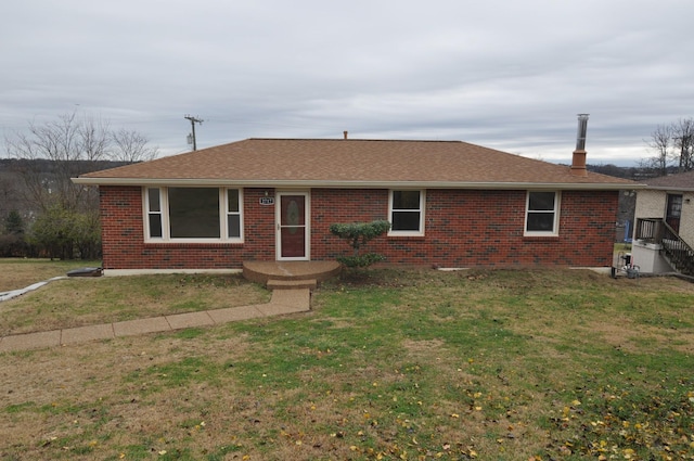 single story home with a front yard