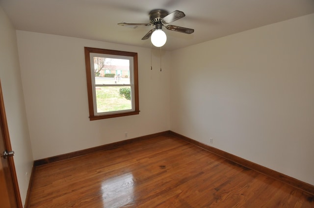 empty room featuring wood-type flooring and ceiling fan