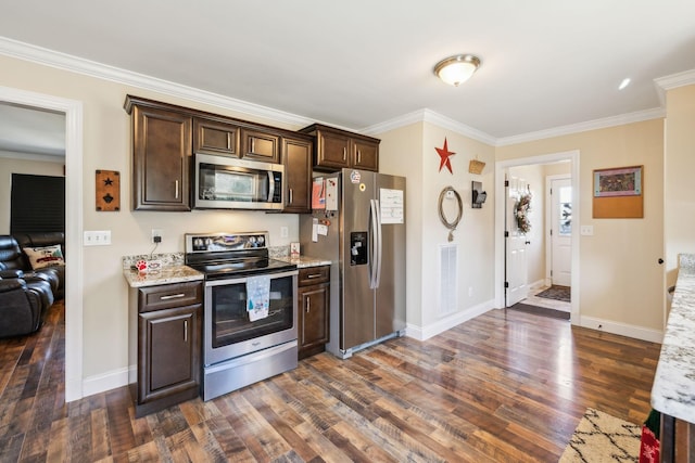 kitchen with light stone countertops, dark hardwood / wood-style flooring, crown molding, dark brown cabinets, and appliances with stainless steel finishes