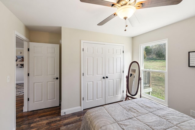 bedroom with ceiling fan, dark hardwood / wood-style floors, and a closet