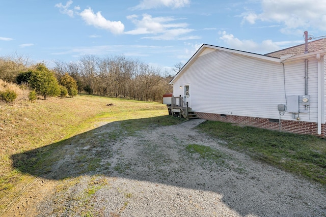 view of side of property with a yard