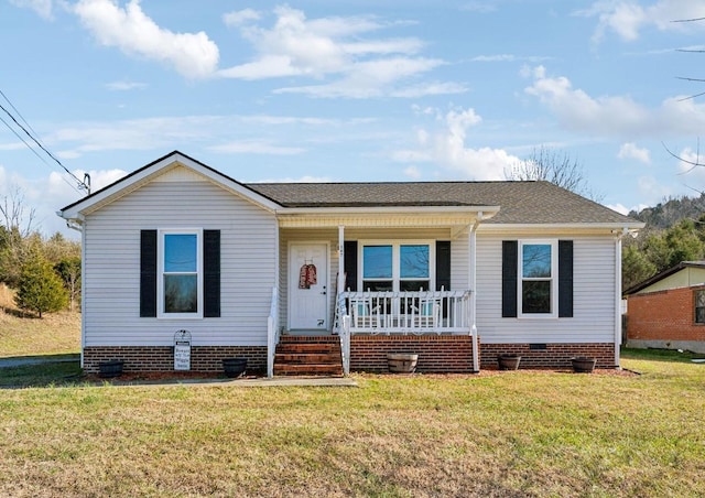 view of front facade with a front lawn and covered porch