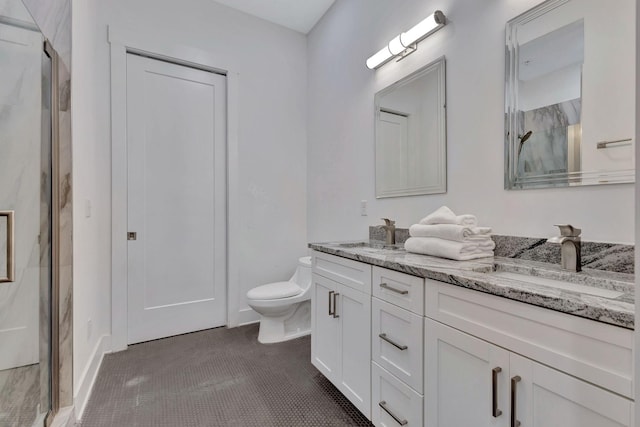 bathroom with tile patterned floors, vanity, and an enclosed shower