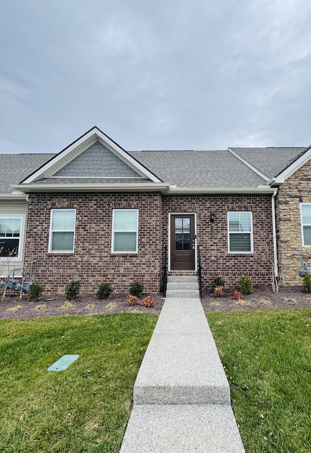 1528 Cedarbrooke Ln, Lebanon, TN 37090 - view of front facade featuring a front yard, a shingled roof, brick siding, and entry steps
