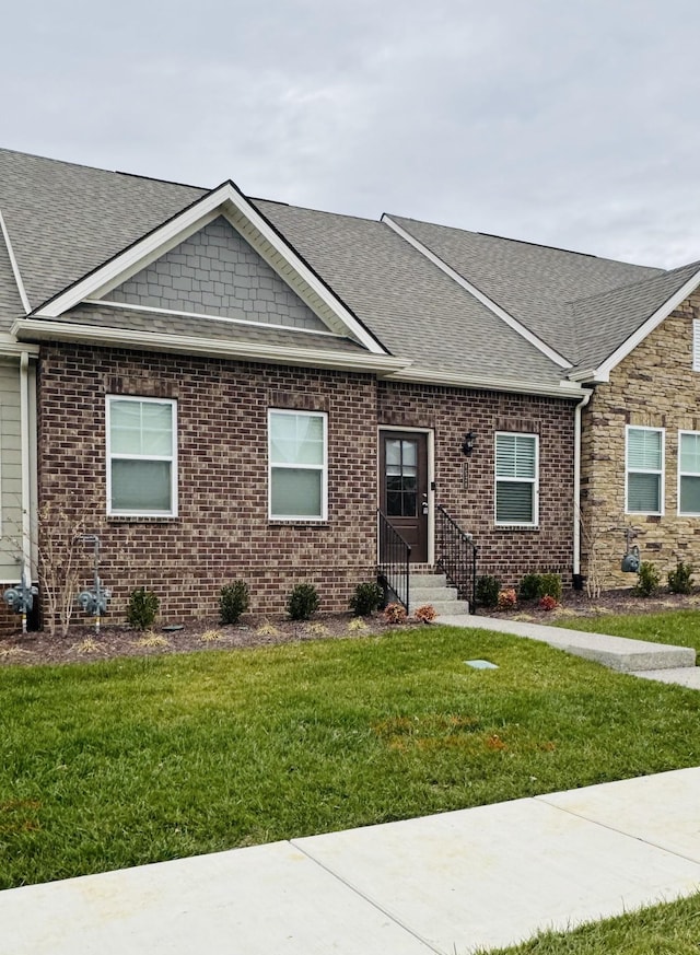 1528 Cedarbrooke Ln, Lebanon, TN 37090 - view of front facade featuring roof with shingles, a front lawn, and brick siding