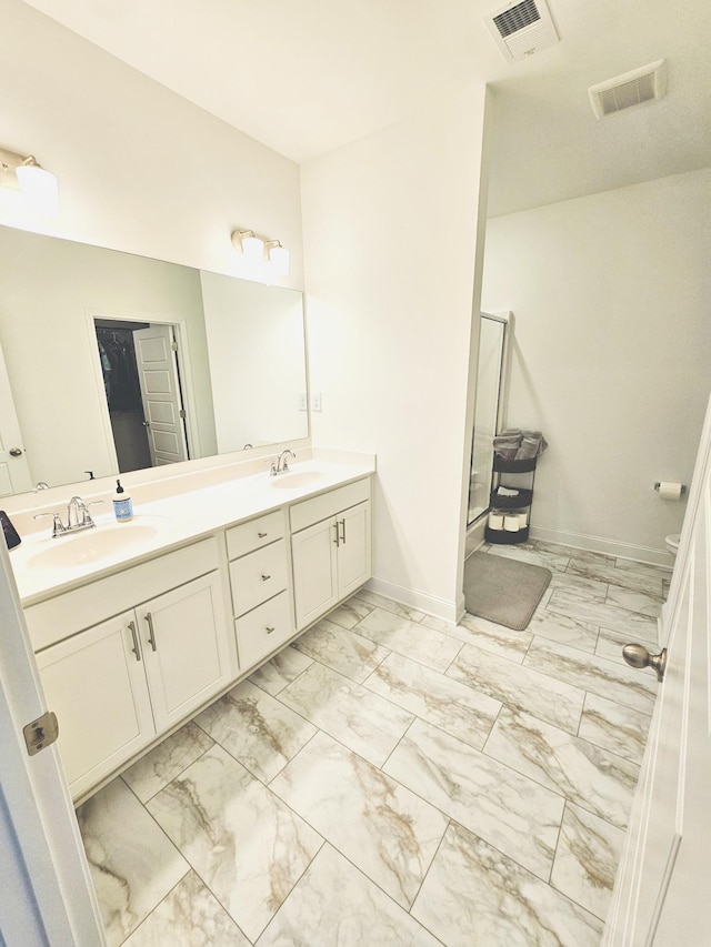 bathroom with vanity and an enclosed shower