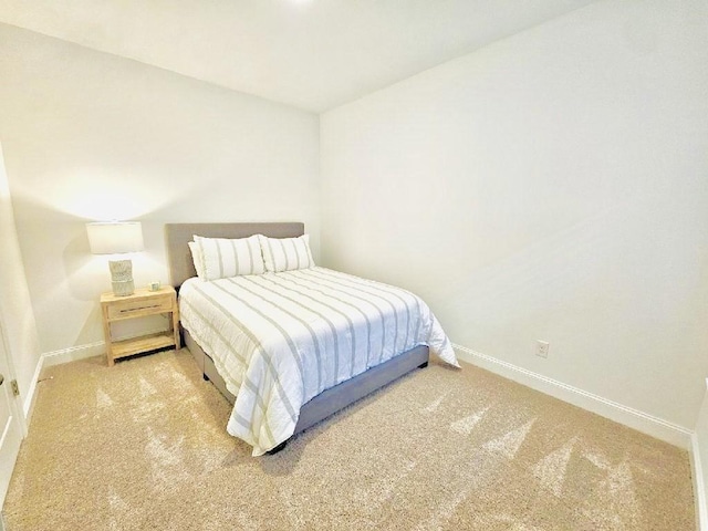 bedroom featuring light colored carpet