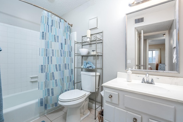 full bathroom featuring toilet, shower / bath combo, tile patterned flooring, a textured ceiling, and vanity