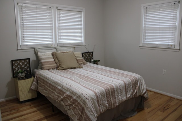 bedroom featuring wood-type flooring