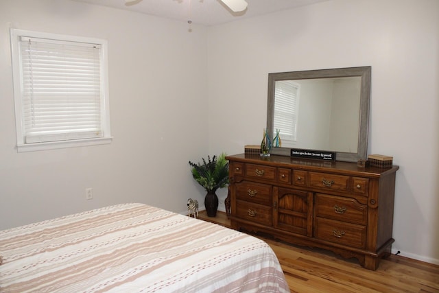 bedroom featuring ceiling fan and light hardwood / wood-style floors