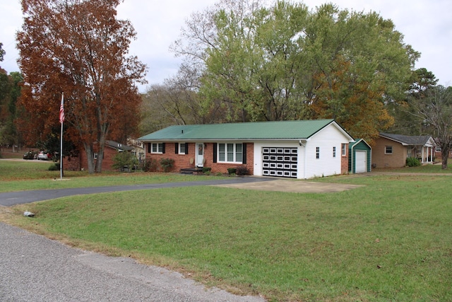 ranch-style house with a garage and a front lawn