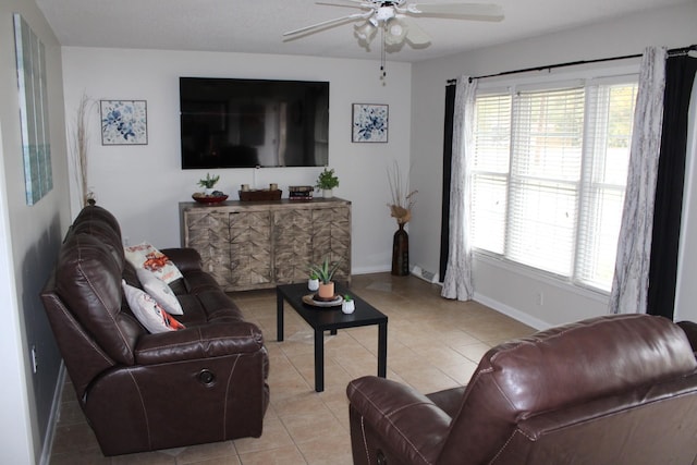 tiled living room with ceiling fan