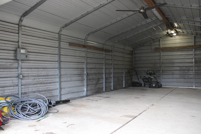 garage with ceiling fan and a carport