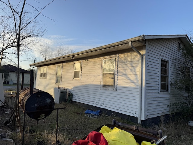 view of side of property with cooling unit