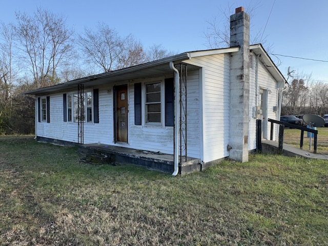 view of front of home with a garage and a front lawn