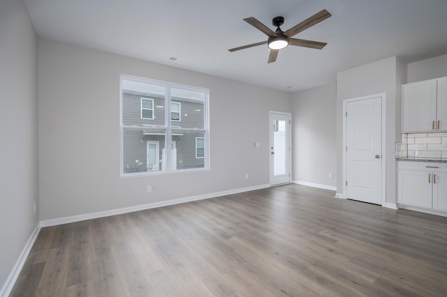 unfurnished living room with ceiling fan and light hardwood / wood-style floors