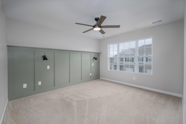 unfurnished bedroom with ceiling fan and light carpet