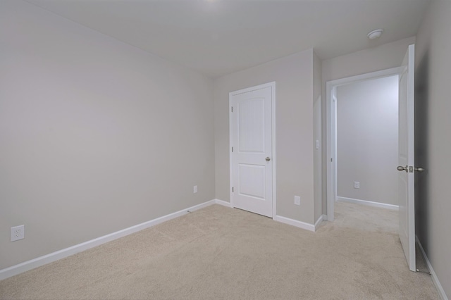 unfurnished bedroom with light carpet