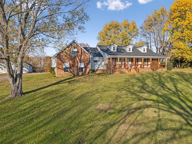 view of front of property featuring a porch and a front yard