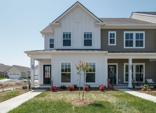 view of front of house with a porch and a front lawn