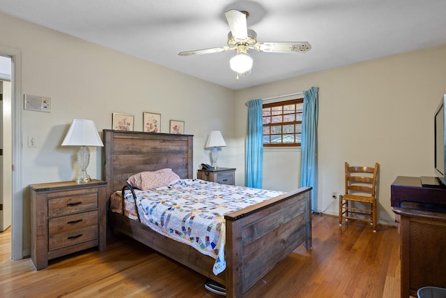 bedroom featuring ceiling fan and wood-type flooring