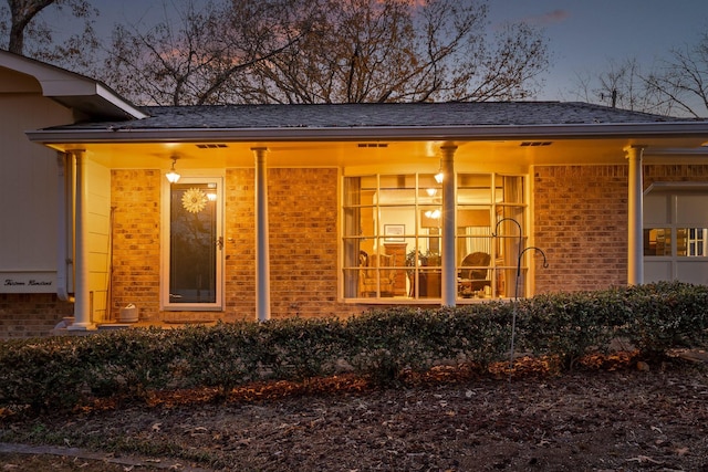 view of outdoor structure at dusk