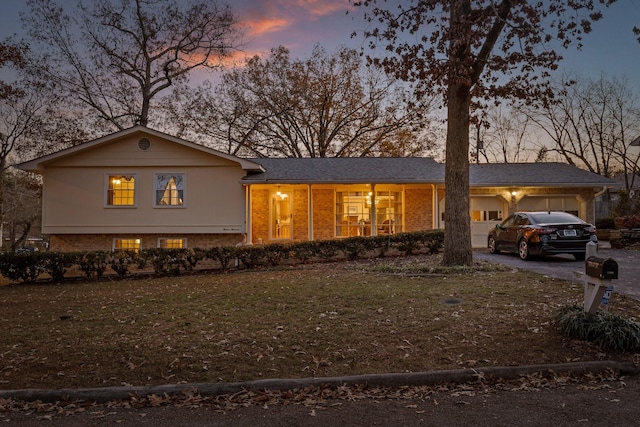 view of front of house with a lawn and a garage