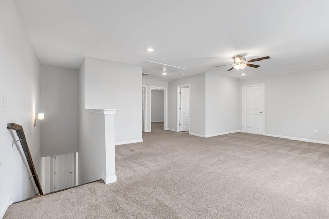 carpeted empty room featuring ceiling fan