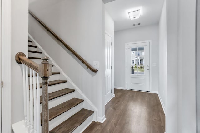 entryway with dark wood-type flooring