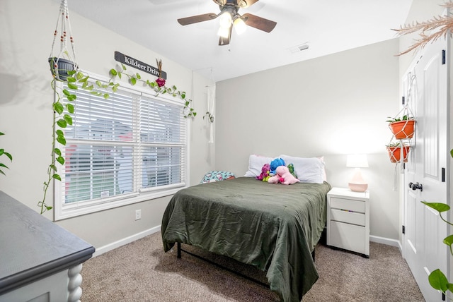 bedroom with ceiling fan and carpet