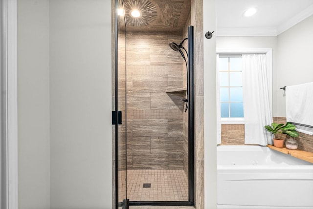 bathroom featuring crown molding and shower with separate bathtub