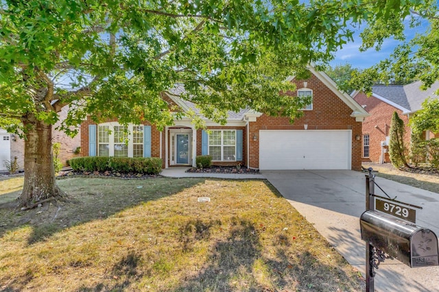 view of front of home with a garage and a front lawn