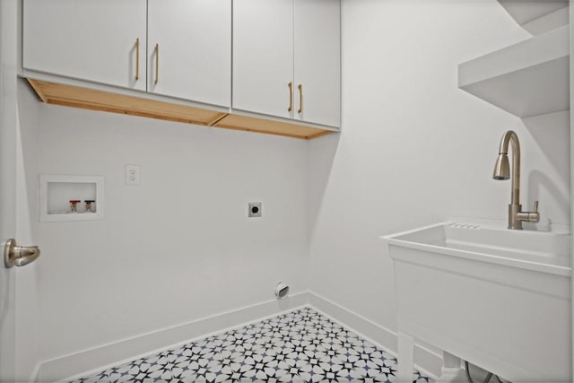 laundry area featuring hookup for an electric dryer, cabinets, and washer hookup