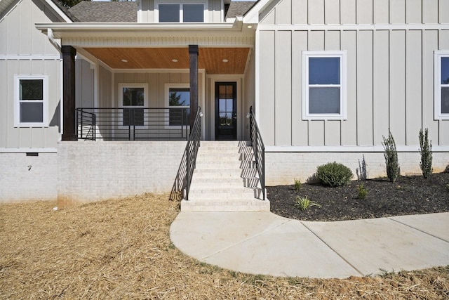 view of exterior entry featuring a porch