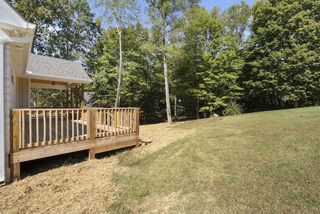 view of yard with a wooden deck