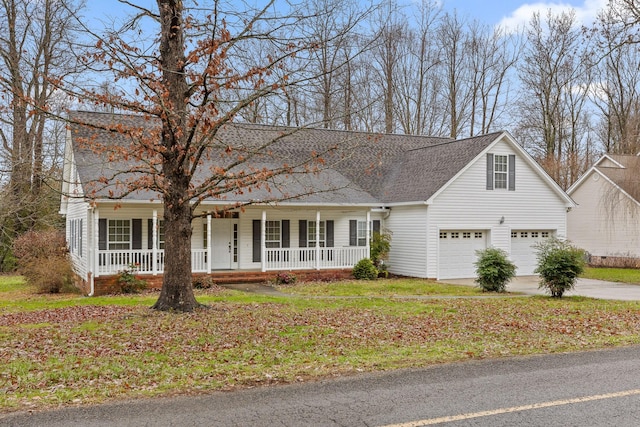 view of front of home with covered porch and a garage