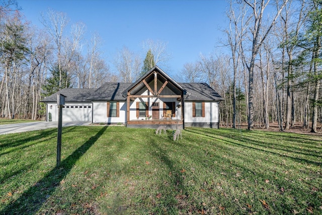 view of front of home featuring a garage and a front lawn