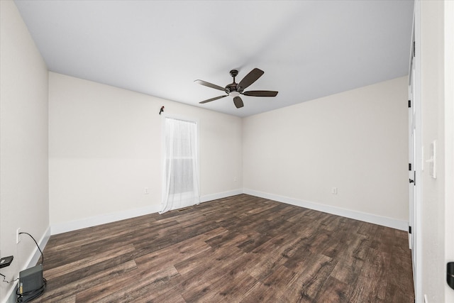 unfurnished room with dark hardwood / wood-style flooring and ceiling fan