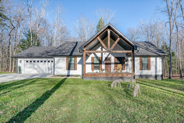 view of front of house with a garage and a front yard